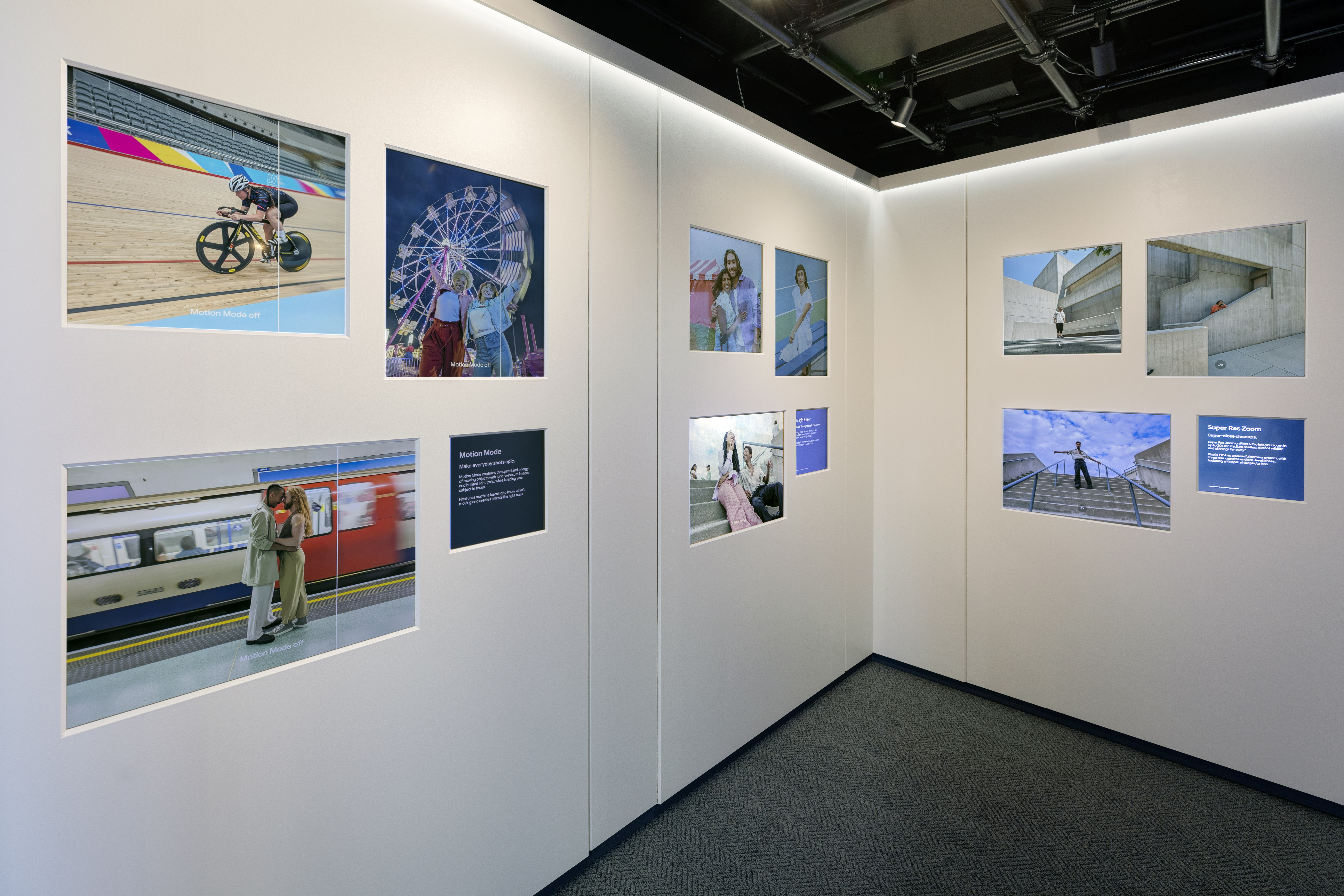 Inside of the completed Sandbox Room with gallery walls of large-format prints showcasing Motion Mode, Magic Eraser, and Super Res Zoom features
