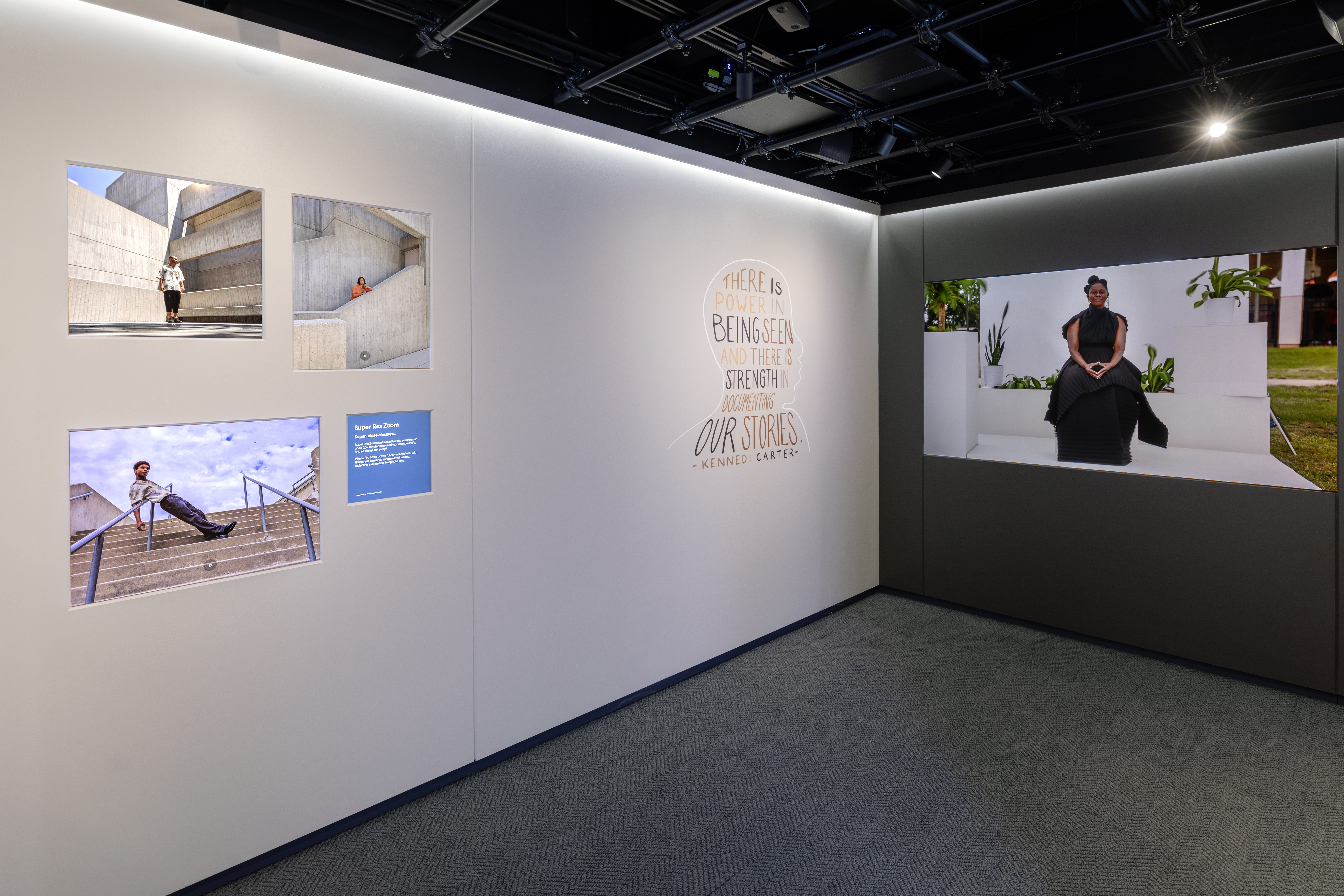Another view of the interior of the Sandbox Room — Super Res Zoom prints, a Kennedi Carter quote wall, and a portrait display