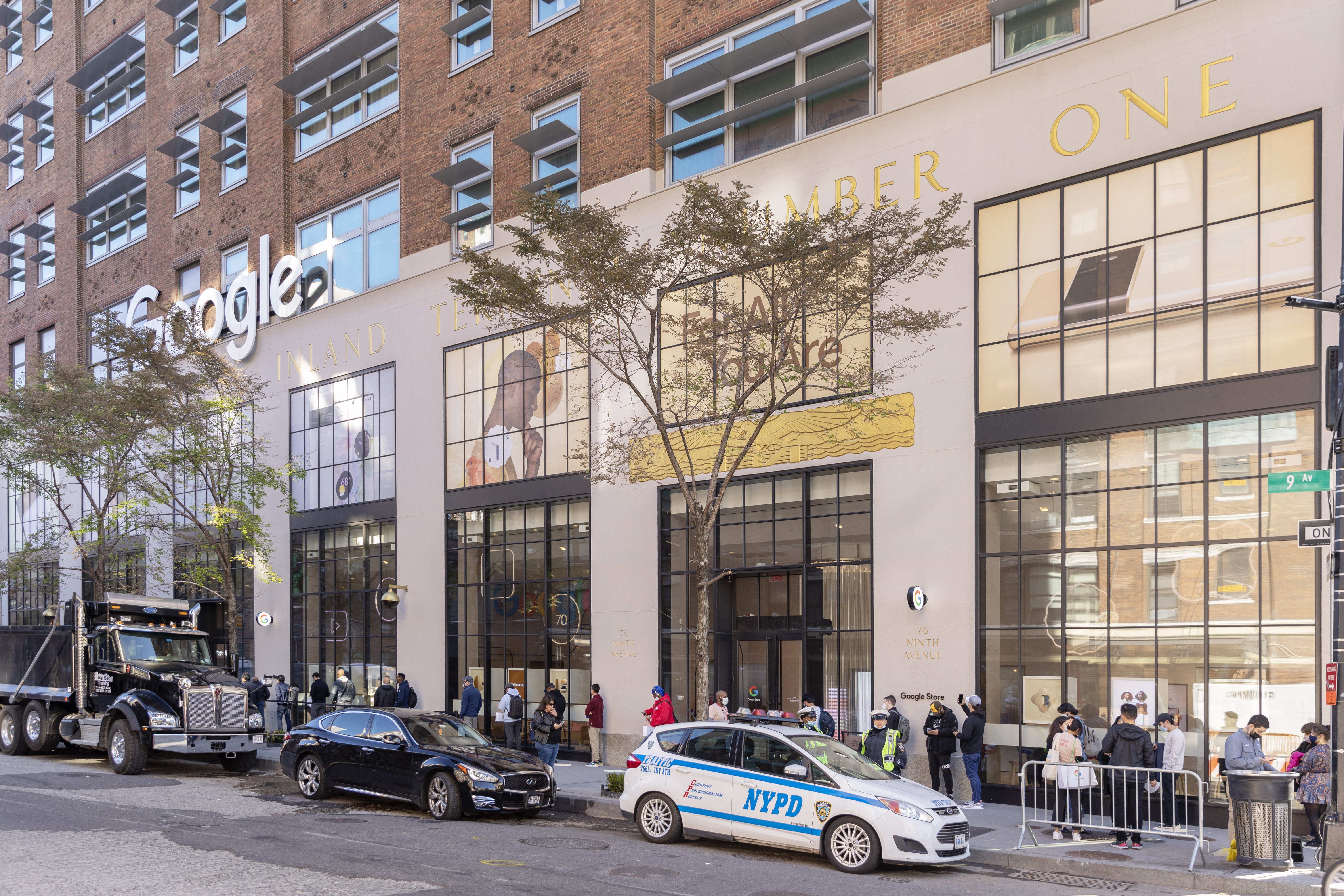 Google Store NYC exterior on Pixel 6 launch day with a line of guests outside on Ninth Avenue