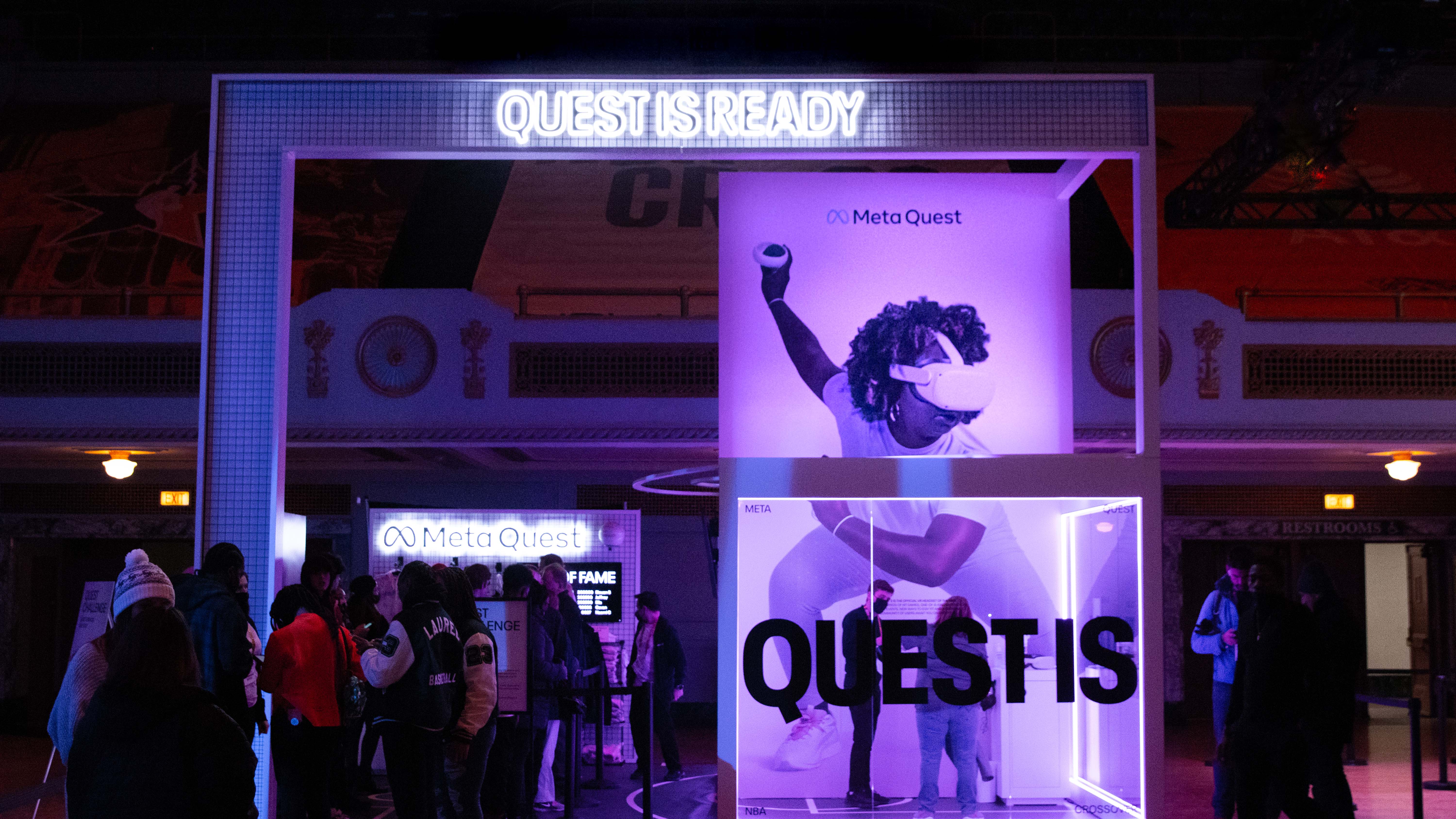 Front of the final Meta Quest booth featuring signage and a typographic graphic on the glass