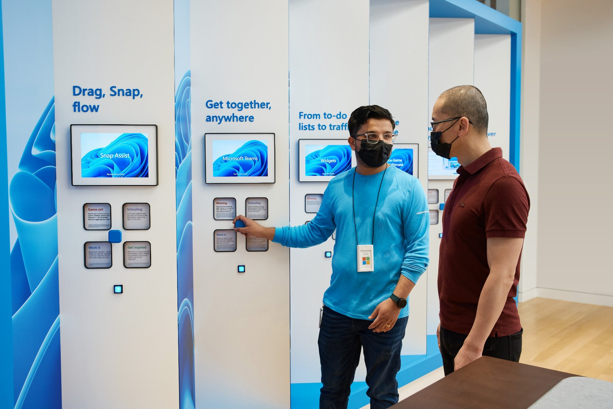 Microsoft Windows 11 Launch in-store experience — Snap Assist and Microsoft Teams displays with interactive tiles